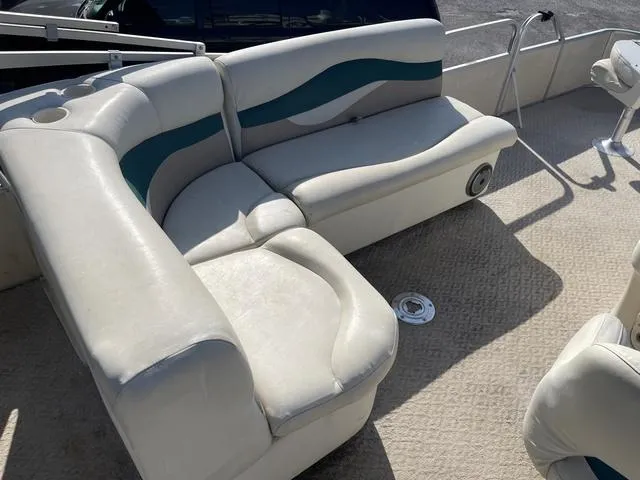 Slide: The Image of 2006 Godfrey Parti Kraft 1980F pontoon boat interior with white and teal seating. - 7
