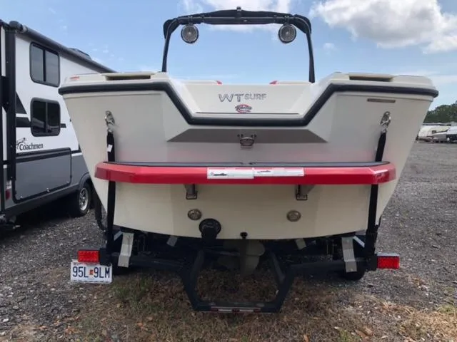 Slide: The Image of 2019 Heyday WTSurf boat rear view in a parking lot. - 13