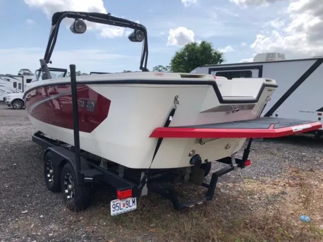 Slide: The Image of 2019 Heyday WTSurf boat on trailer, rear view, red and white color scheme. - 14