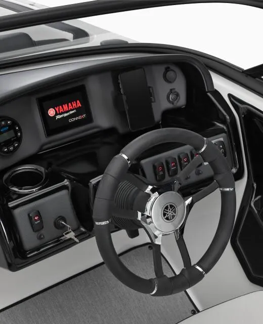 Slide: The Image of 2024 Yamaha AR195 19FT boat dashboard with steering wheel and control panel. - 3