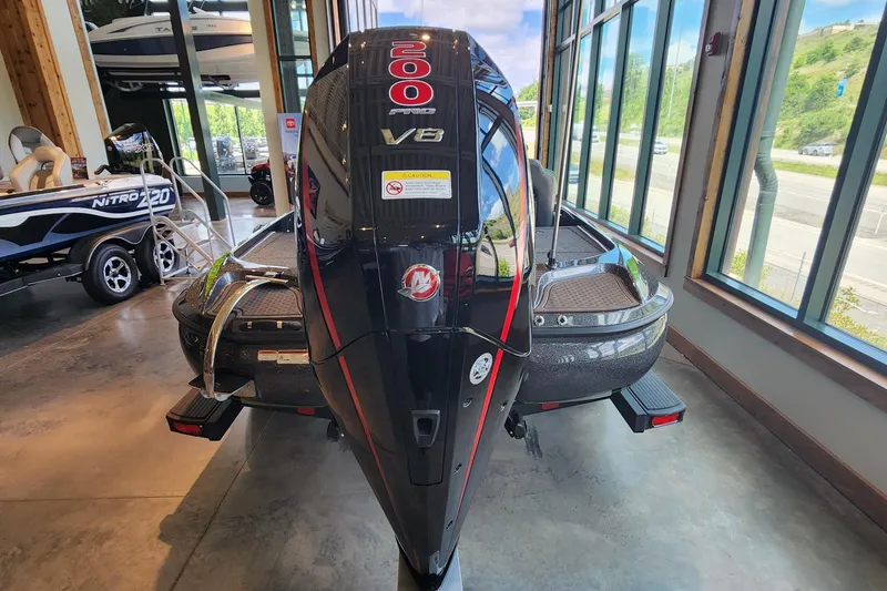 Slide: The Image of 2024 Nitro Z19 boat with 200 HP V8 engine displayed indoors. - 4