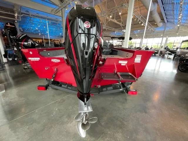Slide: The Image of 2024 Tracker Targa V-19 WT boat displayed in a showroom. - 10
