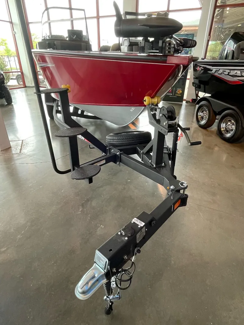 Slide: The Image of 2024 Tracker Targa V-19 WT boat on trailer in showroom. - 11