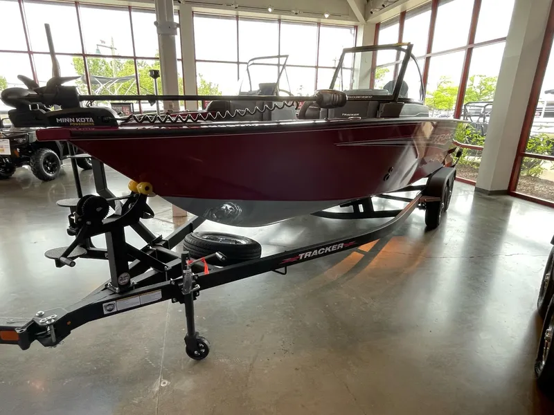 Slide: The Image of 2024 Tracker Targa V-19 WT boat on display in a showroom. - 2