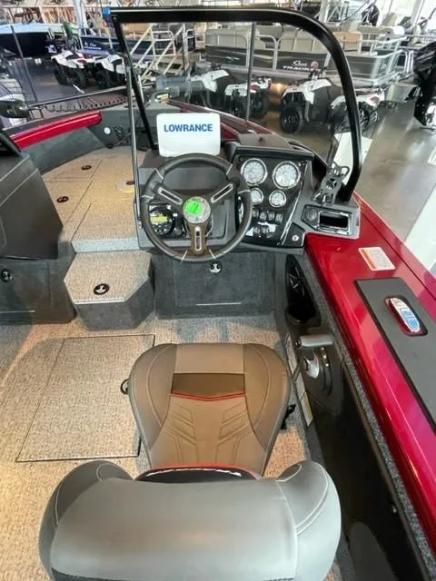 Slide: The Image of 2024 Tracker Targa V-19 WT boat interior with steering console and seating. - 5