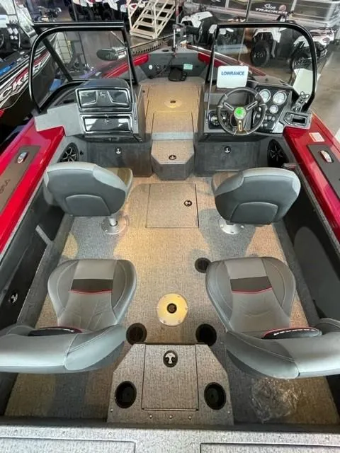 Slide: The Image of 2024 Tracker Targa V-19 WT boat interior with four seats and modern dashboard. - 6