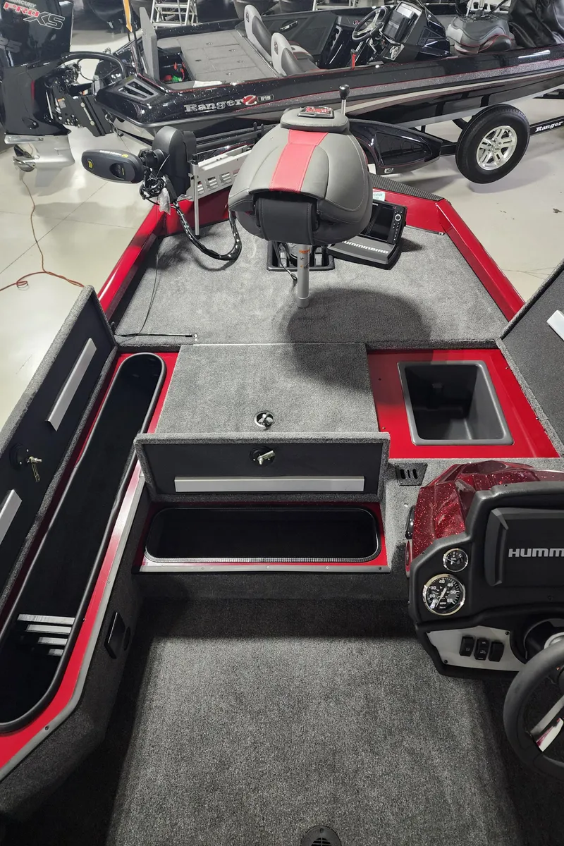 Slide: The Image of 2024 Ranger RT178 fishing boat interior with storage compartments and seating. - 7
