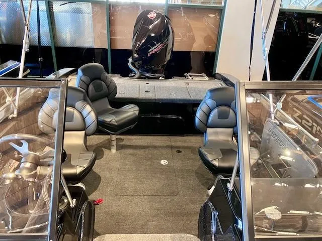 Slide: The Image of 2024 Nitro ZV19 Sport Pro boat interior with seating and motor. - 4