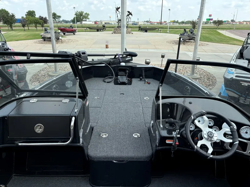 Slide: The Image of 2024 Nitro ZV19 Sport Pro boat interior with steering wheel and dashboard. - 4