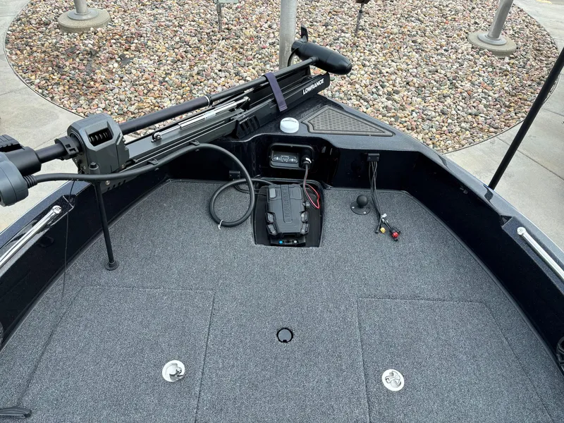 Slide: The Image of 2024 Nitro ZV19 Sport Pro boat deck with trolling motor and storage compartments. - 6