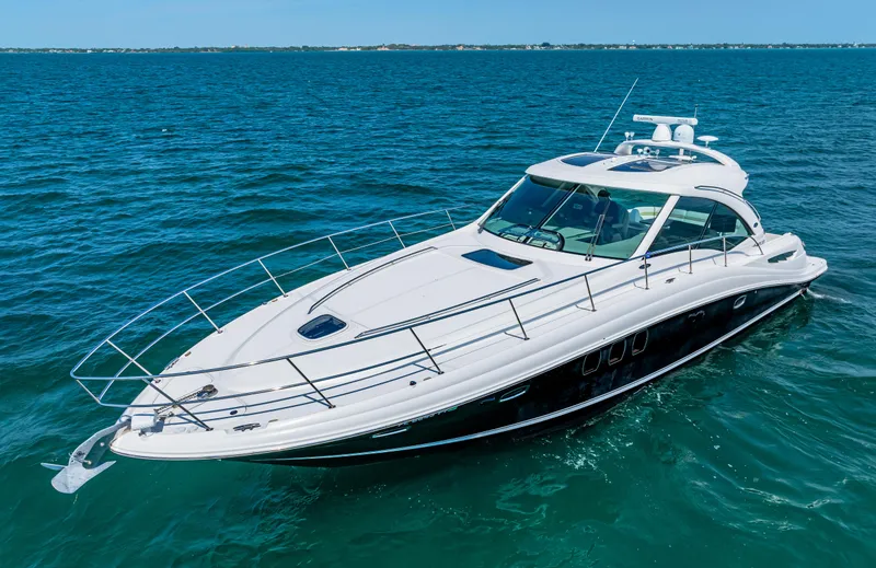 Slide: The Image of 2010 Sea Ray 500 Sundancer luxury yacht cruising on open water. - 0