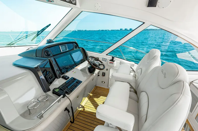 Slide: The Image of Cockpit of 2010 Sea Ray 500 Sundancer yacht with ocean view. - 41