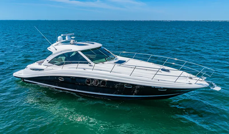 Slide: The Image of 2010 Sea Ray 500 Sundancer luxury yacht cruising on open water. - 5
