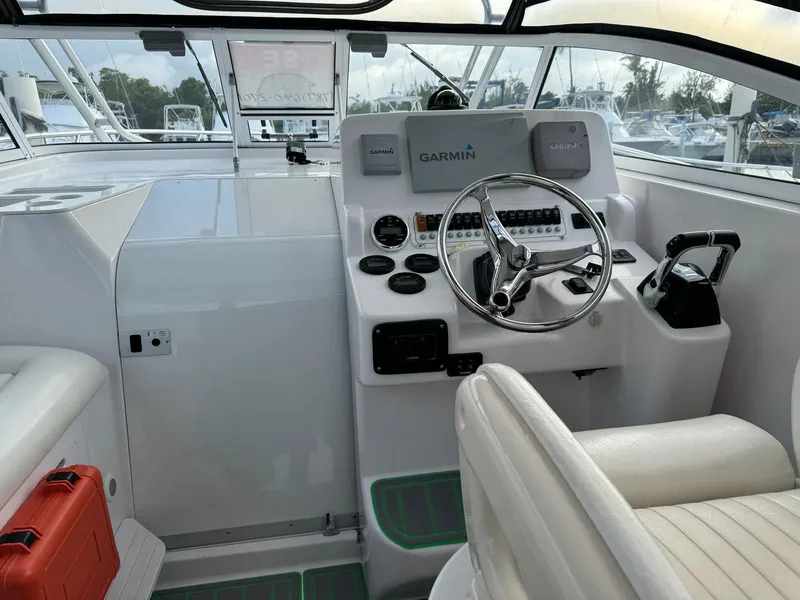 Slide: The Image of 2006 Pro-Line 32 Express boat cockpit with Garmin navigation system and steering wheel. - 4