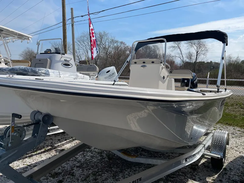 The Image of 2024 Carolina Skiff 17 LS boat on a trailer with a canopy. - 0