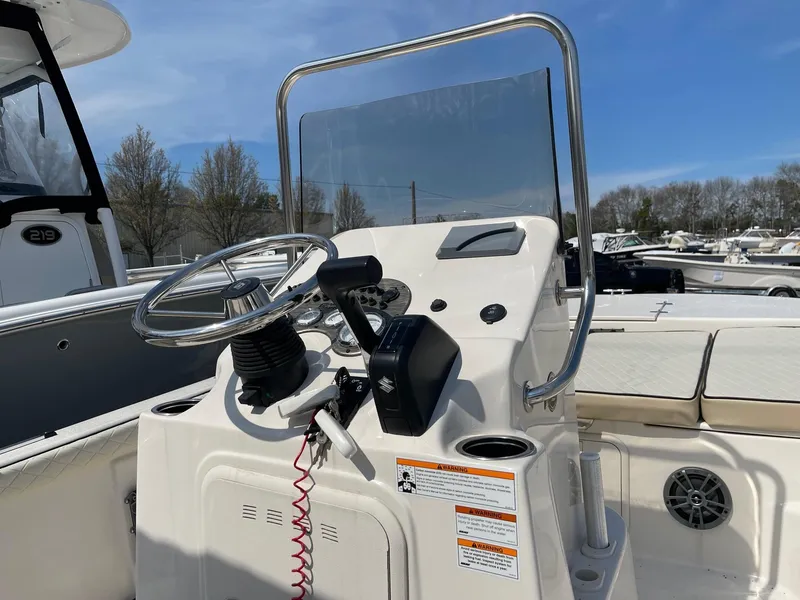 Slide: The Image of 2024 Carolina Skiff 17 LS boat console with steering wheel and controls. - 3