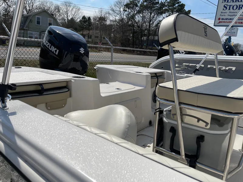 Slide: The Image of 2024 Carolina Skiff 17 LS boat interior with Suzuki outboard motor. - 5