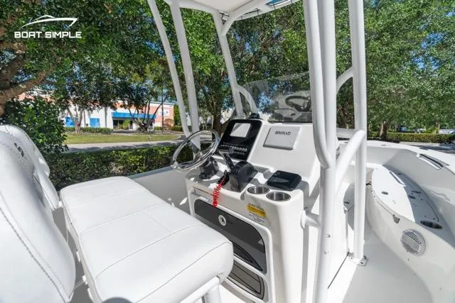 Slide: The Image of 2023 Sea Pro 199 Deep V Center Console boat interior with steering wheel and seating. - 7