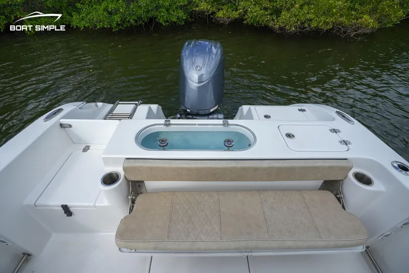 Slide: The Image of 2023 Sea Pro 219 Deep V CC boat stern with seating and outboard motor. - 5