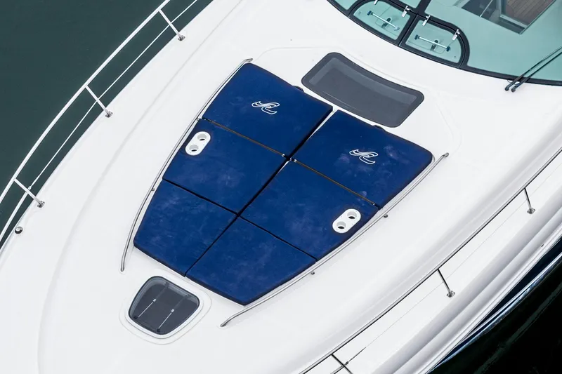 Slide: The Image of 2007 Sea Ray 48 Sundancer yacht with blue sun pads on deck. - 11