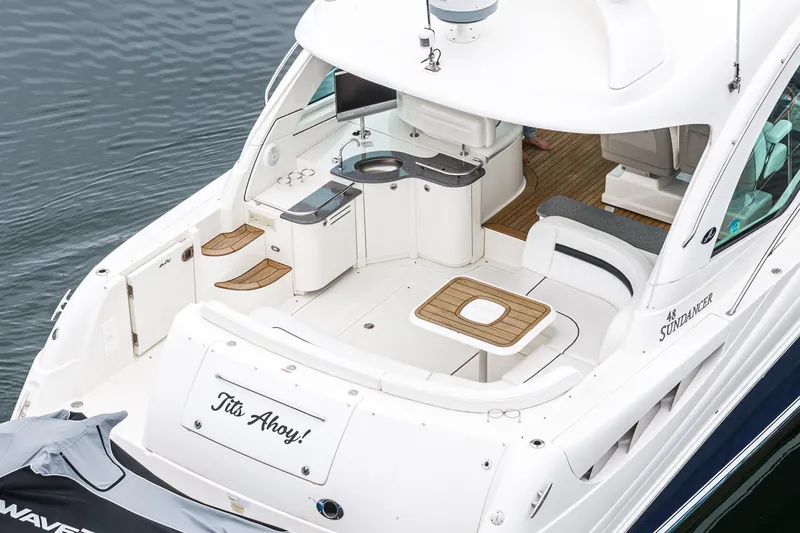 Slide: The Image of 2007 Sea Ray 48 Sundancer yacht with spacious deck and seating area. - 17