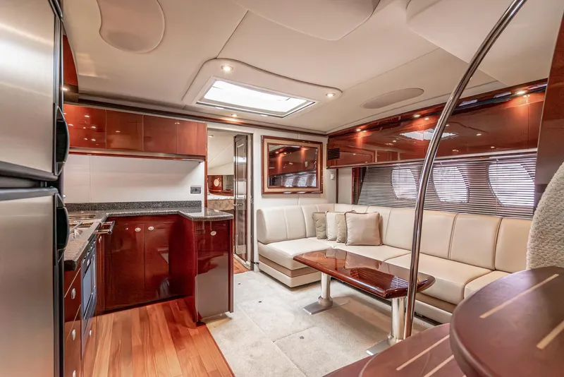 Slide: The Image of Luxurious interior of 2007 Sea Ray 48 Sundancer yacht with modern kitchen and seating area. - 29