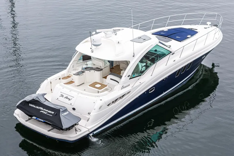 Slide: The Image of 2007 Sea Ray 48 Sundancer yacht on water, featuring sleek design and spacious deck. - 3