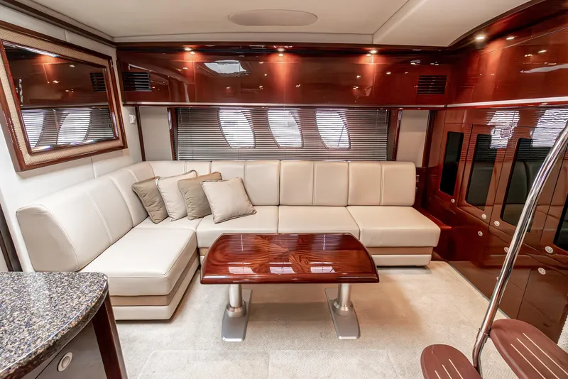 Slide: The Image of Luxurious interior of 2007 Sea Ray 48 Sundancer yacht with elegant seating and wooden accents. - 31
