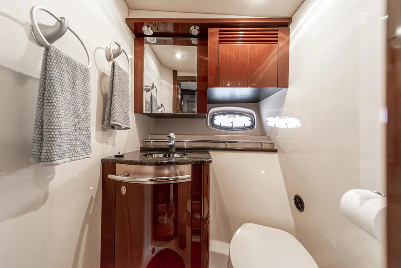 Slide: The Image of Luxurious bathroom in 2007 Sea Ray 48 Sundancer yacht with wood cabinetry and modern fixtures. - 38