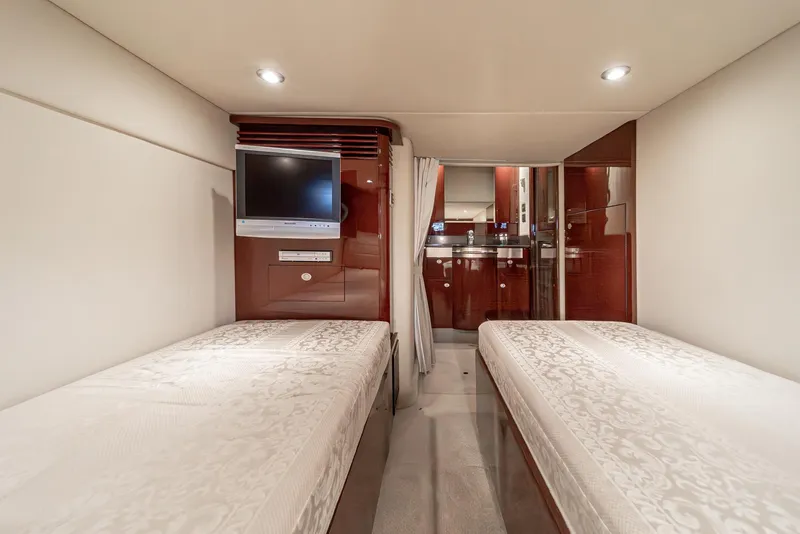 Slide: The Image of Interior of 2007 Sea Ray 48 Sundancer yacht with twin beds and TV. - 41