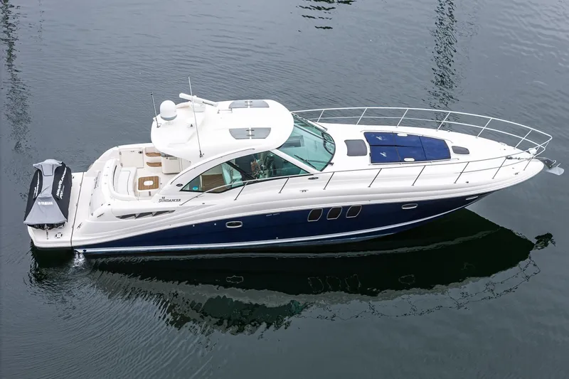 Slide: The Image of 2007 Sea Ray 48 Sundancer yacht on calm water, side view. - 8