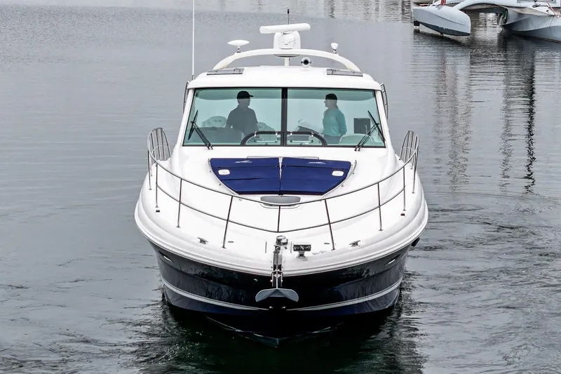 Slide: The Image of 2007 Sea Ray 48 Sundancer yacht on calm water, front view. - 9