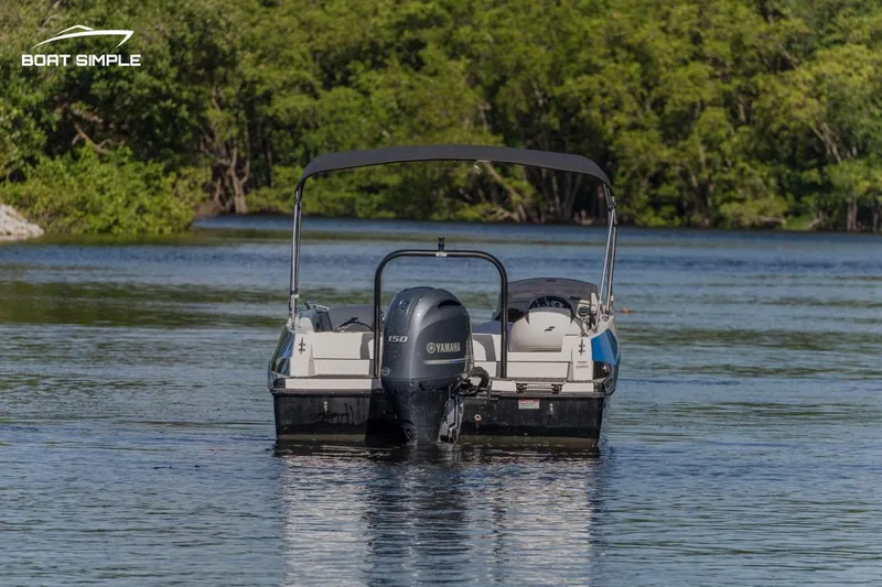Slide: The Image of 2023 Starcraft SVX 211 OB boat on a serene lake. - 1