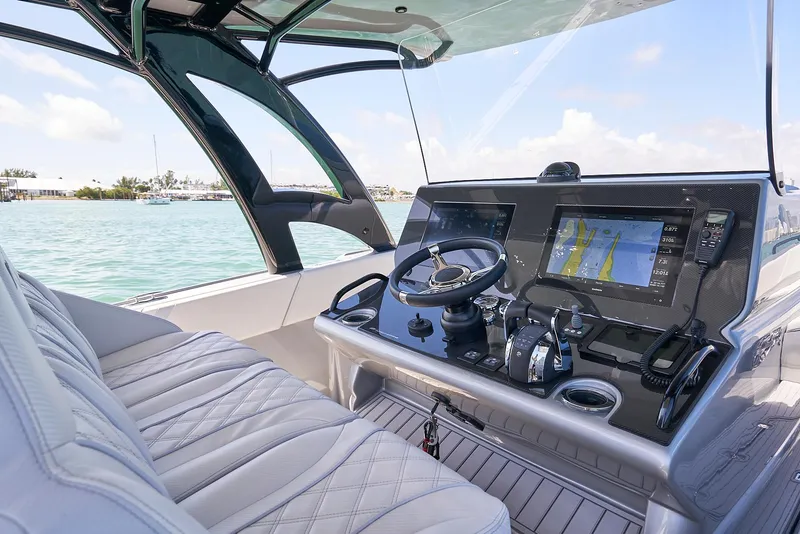 Slide: The Image of 2020 Midnight Express 37' Open boat cockpit with advanced navigation system. - 11