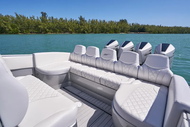 Slide: The Image of 2020 Midnight Express 37' Open boat with luxurious seating and multiple outboard engines. - 16