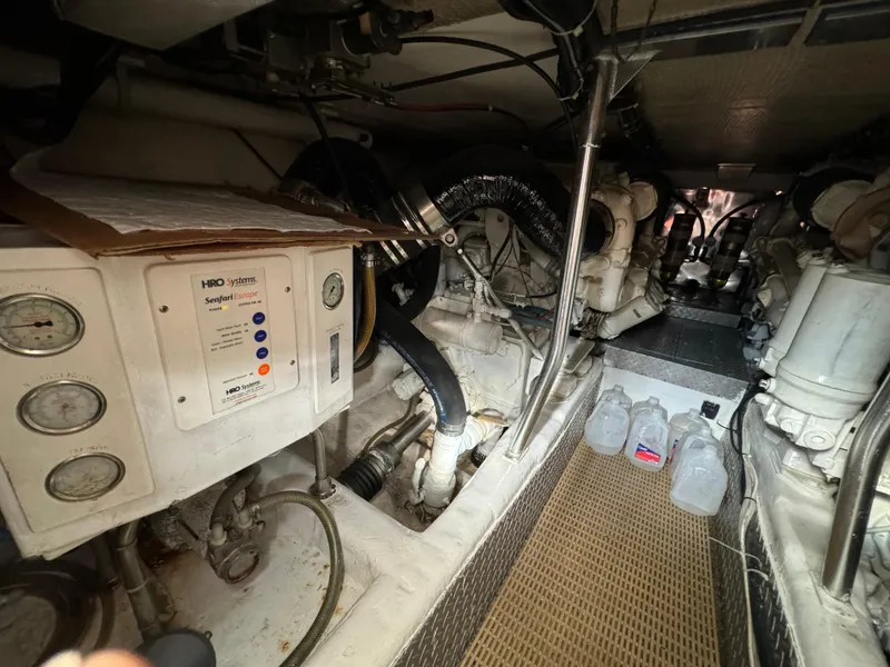 Slide: The Image of Engine room of a 2001 Ocean Yachts 48, featuring machinery and equipment. - 10