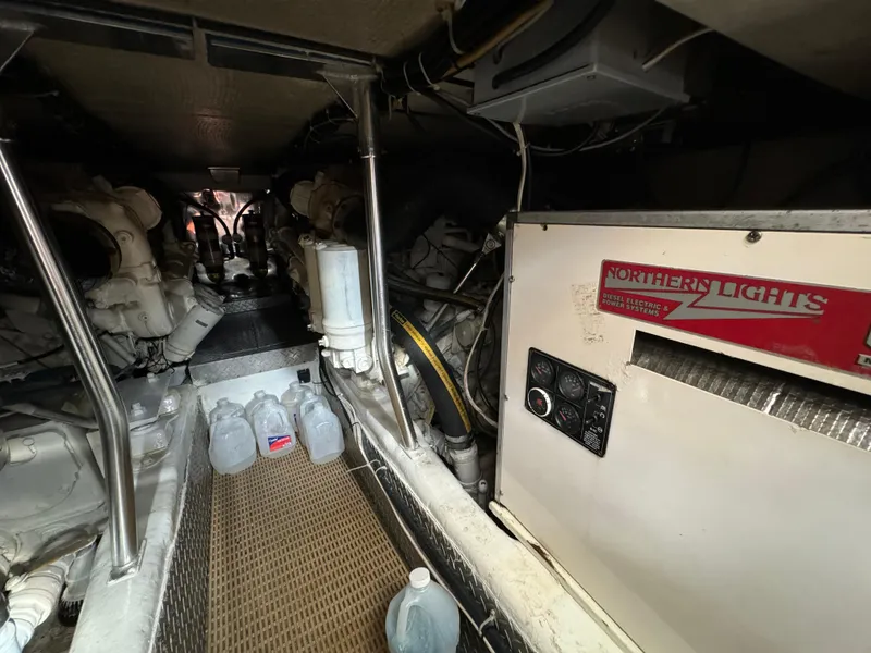 Slide: The Image of Engine room of a 2001 Ocean Yachts 48, featuring Northern Lights generator and equipment. - 11