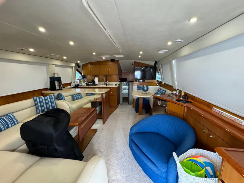 Slide: The Image of Luxurious interior of a 2001 Ocean Yachts 48, featuring elegant seating and modern amenities. - 4