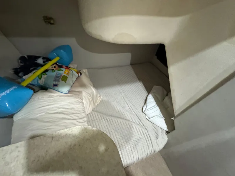 Slide: The Image of Cozy cabin interior of 2001 Ocean Yachts 48 with bedding and pillows. - 8