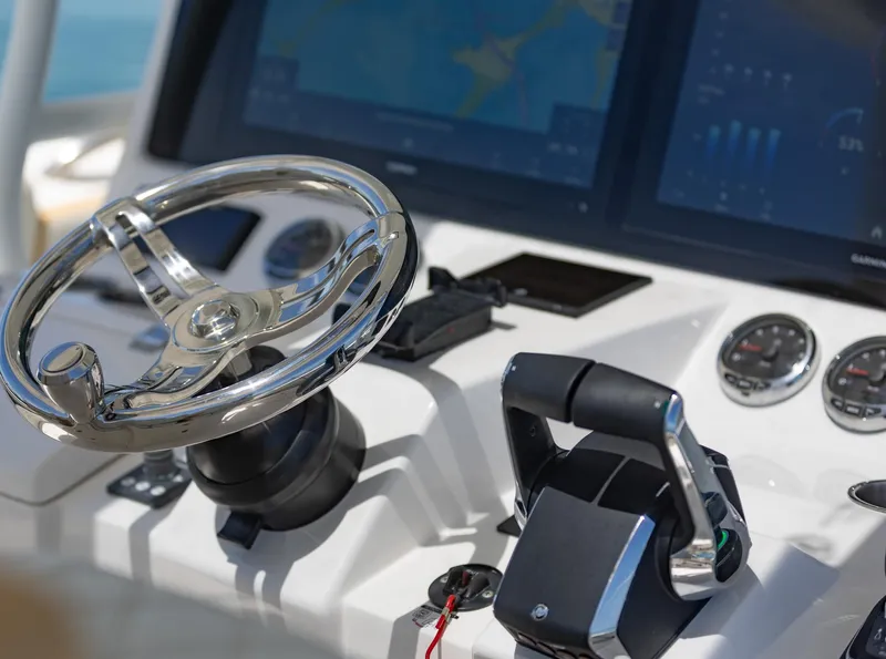 Slide: The Image of Close-up of 2024 Blackwater 43 Sportfish boat helm with steering wheel and controls. - 25