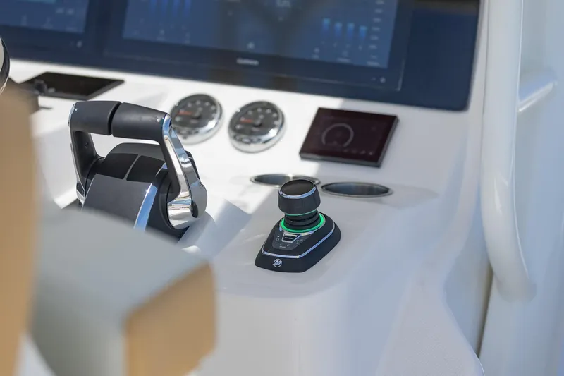 Slide: The Image of Close-up of 2024 Blackwater 43 Sportfish boat control panel and throttle. - 27