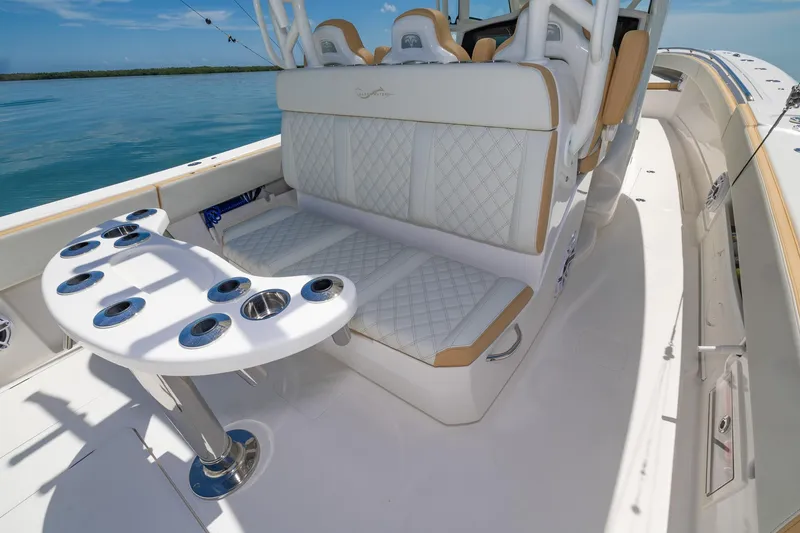 Slide: The Image of 2024 Blackwater 43 Sportfish boat interior with white seating and rod holders. - 35