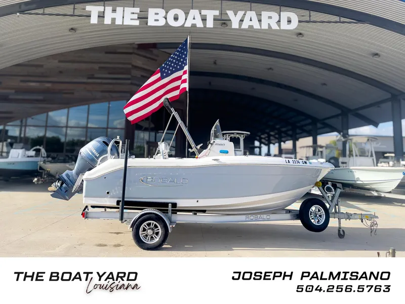 Slide: The Image of 2021 Robalo R180 Center Console boat on trailer at The Boat Yard Louisiana. - 0
