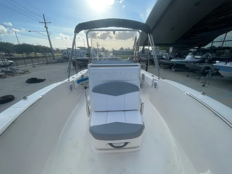 Slide: The Image of 2021 Robalo R180 Center Console boat with seating and canopy. - 12