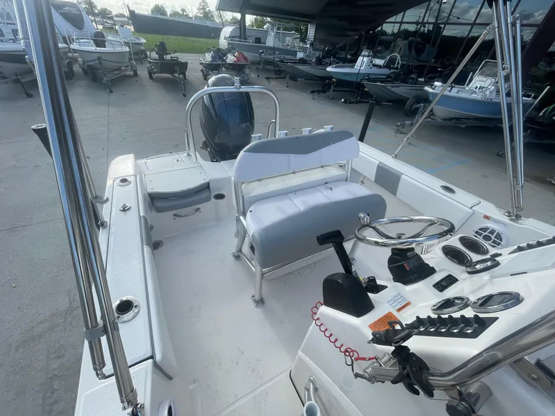 Slide: The Image of 2021 Robalo R180 Center Console boat interior with helm, seating, and controls. - 15