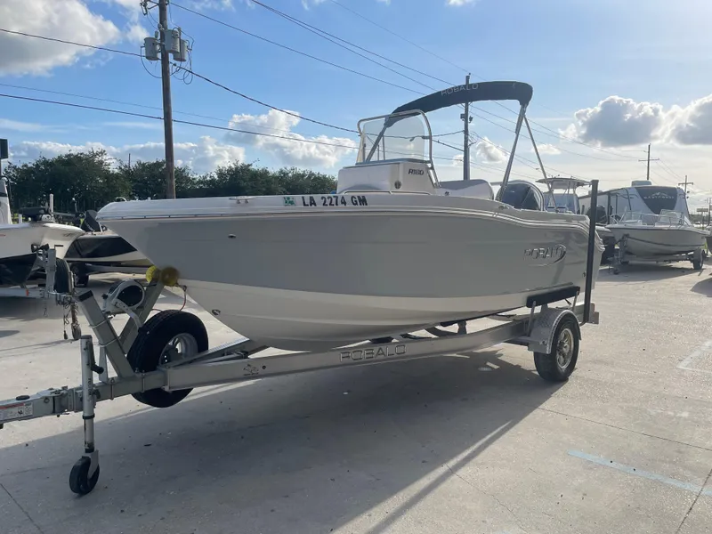 Slide: The Image of 2021 Robalo R180 Center Console boat on trailer in outdoor lot. - 5