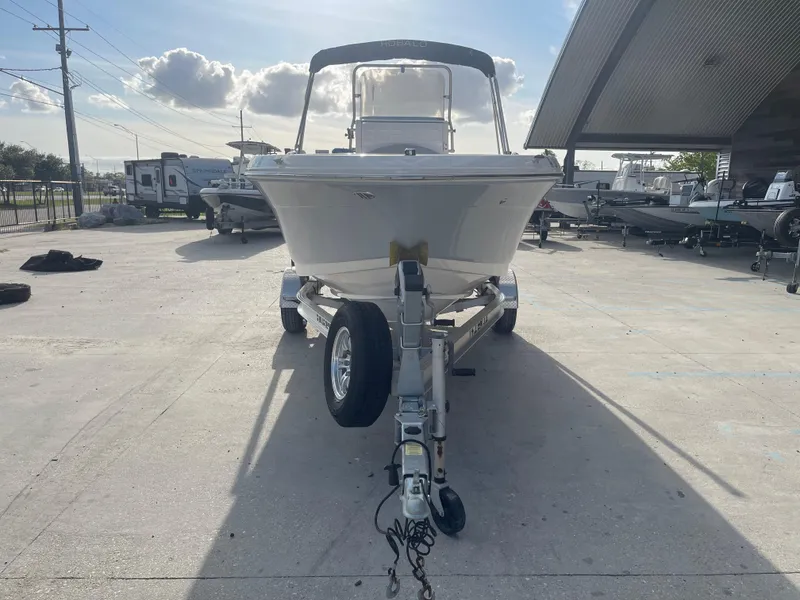 Slide: The Image of 2021 Robalo R180 Center Console boat on trailer in outdoor lot. - 6