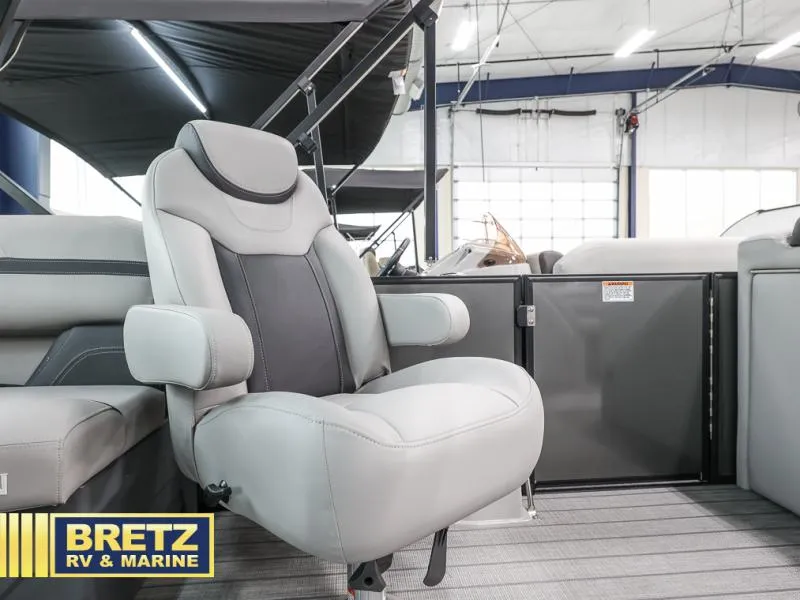 Slide: The Image of 2024 L3 CLZ DH boat interior with plush captain's chair at Bretz RV & Marine showroom. - 16