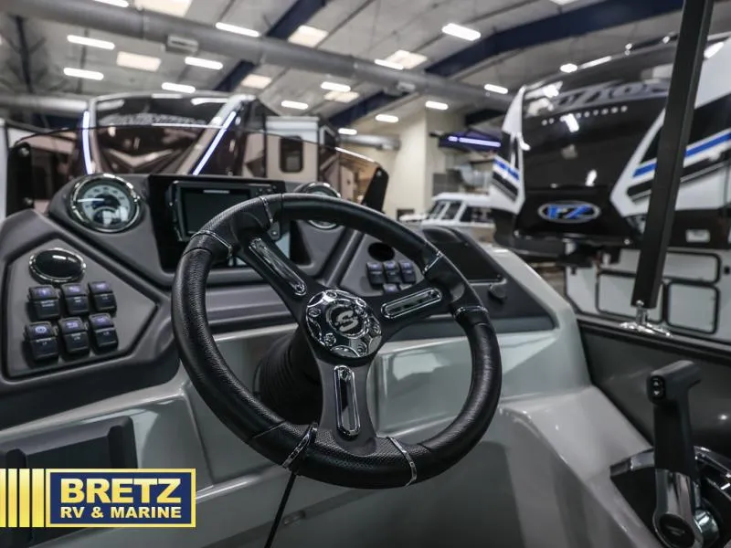 Slide: The Image of 2024 L3 CLZ DH boat dashboard at Bretz RV & Marine showroom. - 6