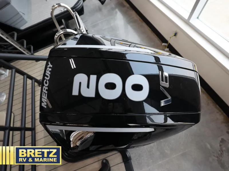 Slide: The Image of 2024 Mercury V6 outboard motor at Bretz RV & Marine showroom. - 14